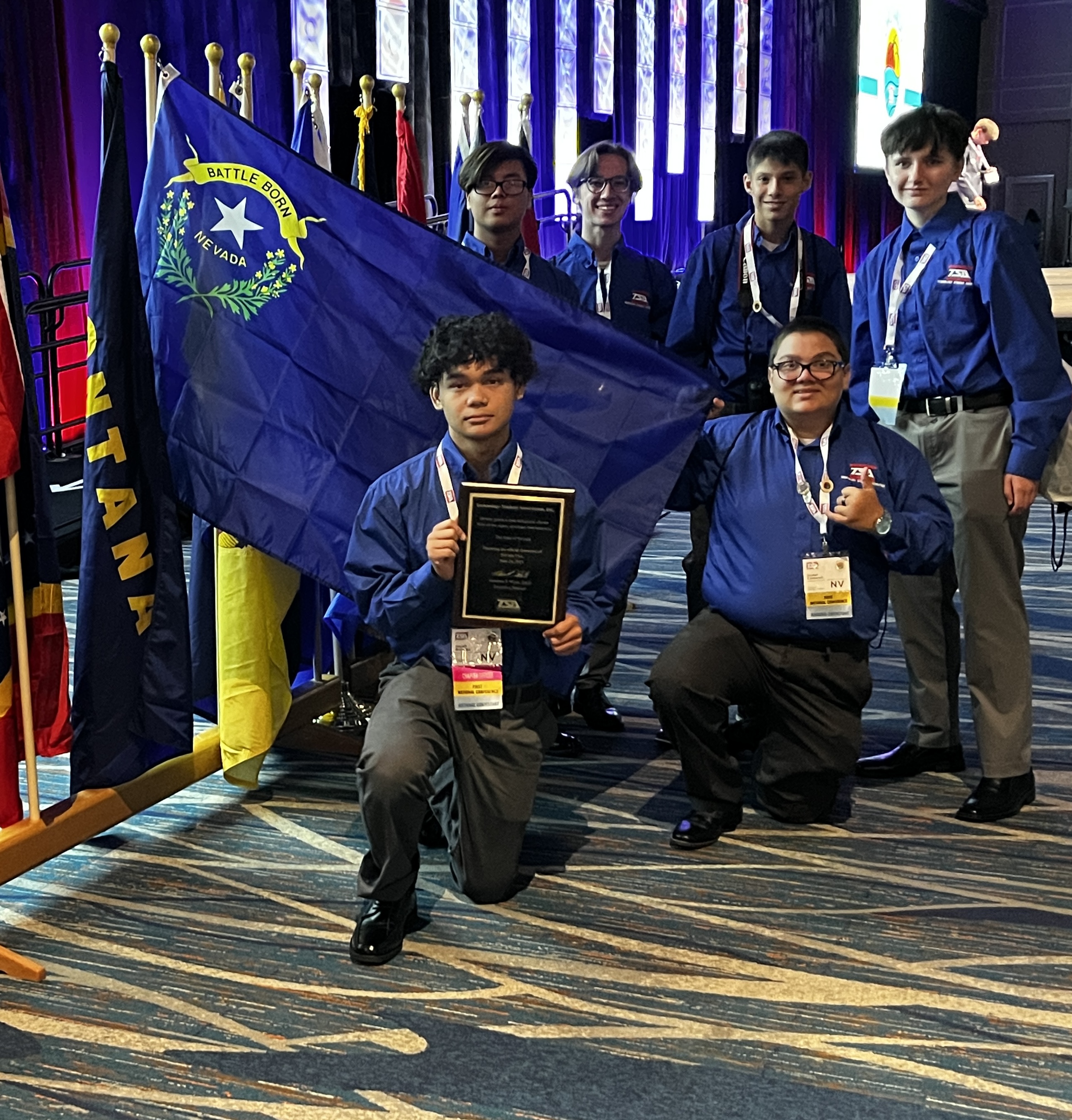 Southwest TSA members with the Nevada flag and an award at the national conference